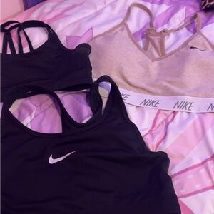 2 Nike small sports bras and one adidas extra small